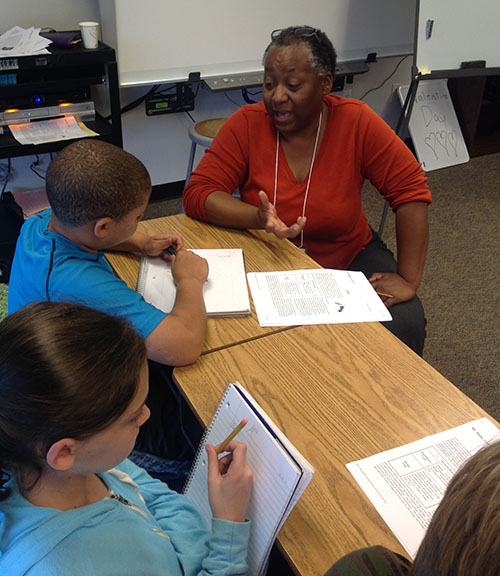woman talking with students 